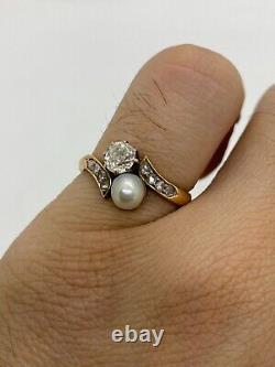Fine 18k gold ring with 0,61 carats of natural diamonds and a cultured pearl
